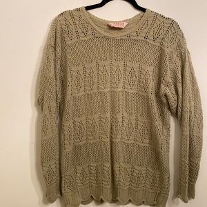 Beige sweater. Cutout design